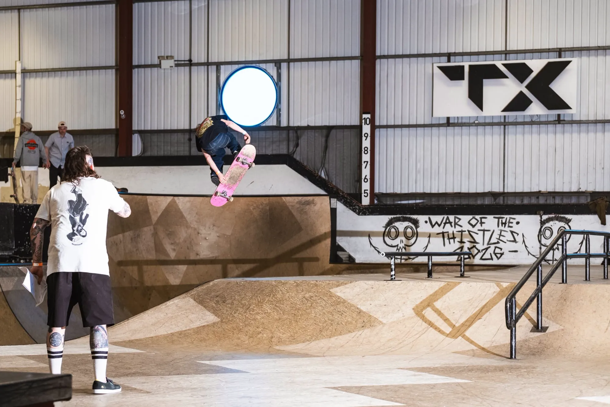 A skateboarder flies off the bank at Transition Extreme skatepark